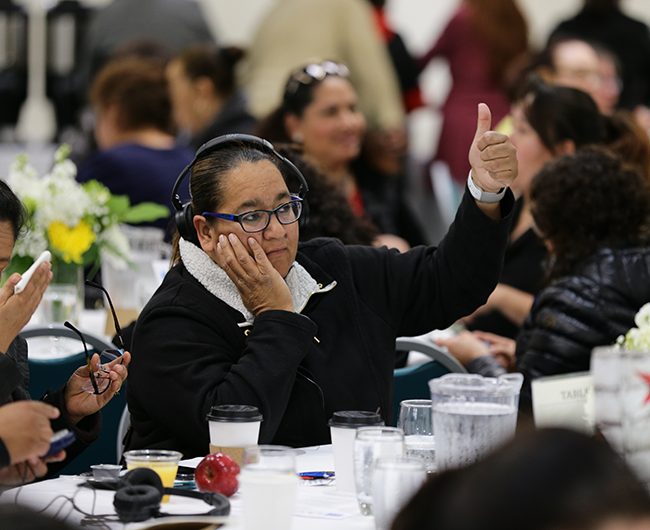 woman giving thumbs up