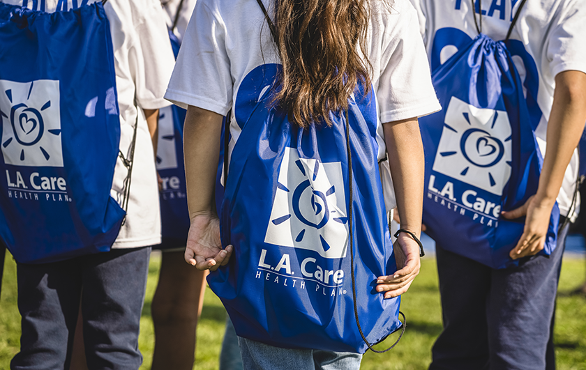 kids with L.A. Care bags