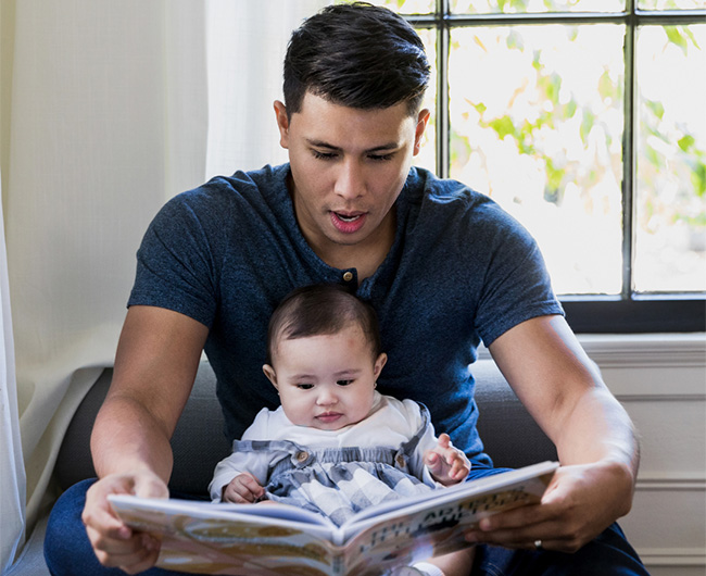 dad reading to baby