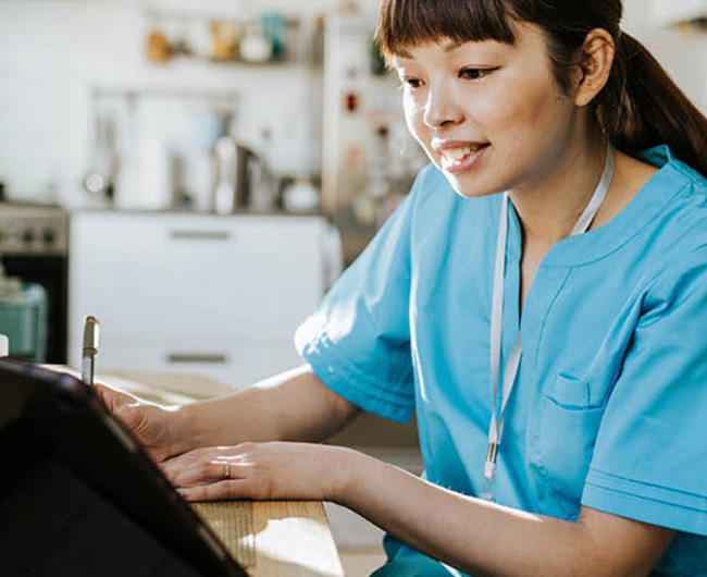 Nurse looking at laptop