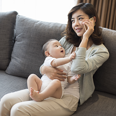 woman with baby on phone