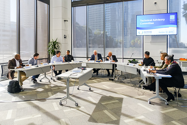 L.A. Care staff having a discussion inside a conference room